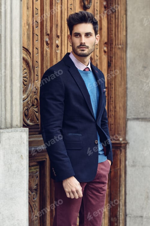 Preview: Attractive man wearing british elegant suit in the street. Modern hairstyle