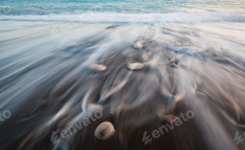 Preview: Seascape with sea waves crashing on the coast at sunset or sunrise.