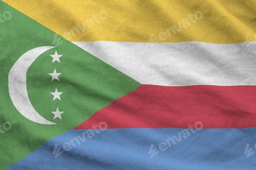 Preview: Comoros flag depicted on folded wavy fabric of old cloth