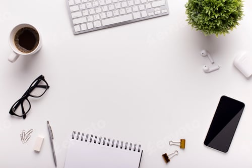Preview: Office table with cellphone, supplies and coffee on white