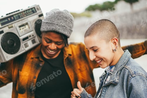 Preview: Multiracial young women dancing outdoor with urban background - Focus on bald girl head