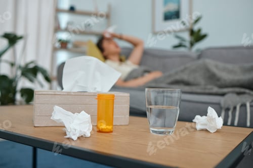 Preview: Pills, tissue and glass on table, living room or sick woman laying on sofa with stress, pain or fru