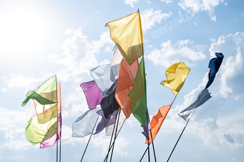 Preview: Colorful flags fluttering on the blue sky background