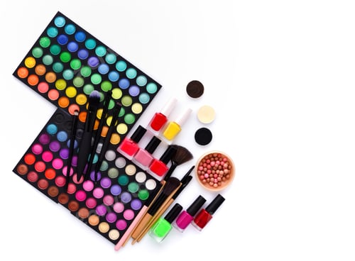 Preview: Set of decorative cosmetics and coloured nail polish bottles on