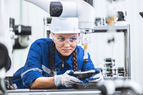 Preview: engineer woman worker working with robotic arm in productions lab research industry factory