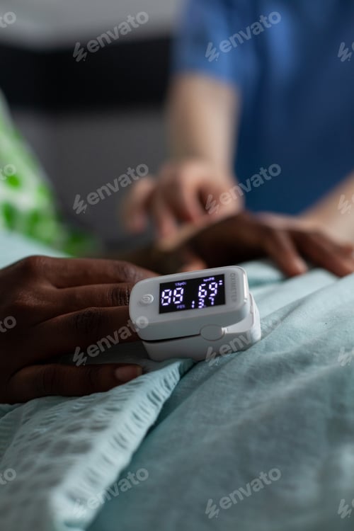 Preview: Close up of oximeter on african american girl hand