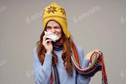Preview: sick woman neck scarf with a hat on his head isolated background