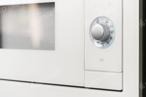Preview: New modern microwave oven in a shop, close up