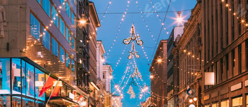 Preview: Helsinki, Finland. Night View Of Aleksanterinkatu Street With Railroad In Kluuvi District In Evening
