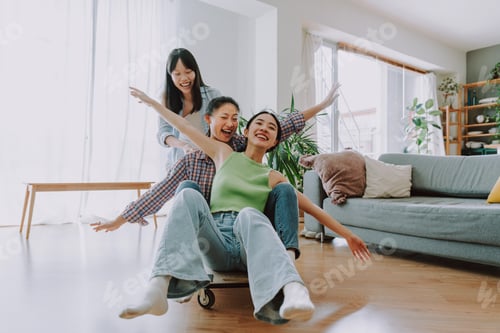 Preview: Happy beautiful chinese women friends bonding at home