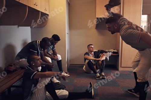 Preview: Shot of a young man yelling at his fellow baseball players in a locker room.