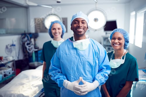 Preview: Portrait Of Multi-Cultural Surgical Team Standing In Hospital Operating Theater