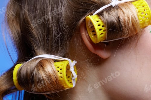 Preview: Close Up Of Girl'S Hair With Yellow Hair Rollers