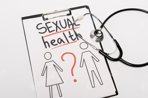 Preview: top view of clipboard with sexual health lettering, drawn man and woman near stethoscope isolated on