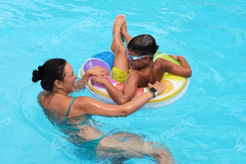 Preview: Laughter echoes over water; summer's playful spirit. Mirrors the movement towards outdoor