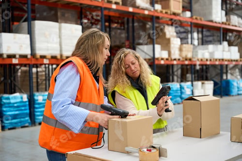 Preview: Warehouse workers scanning packages with barcode readers