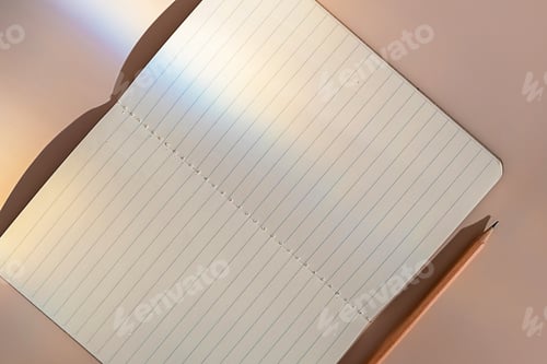 Preview: Empty lined sheets notebook in sunlight flare leak.