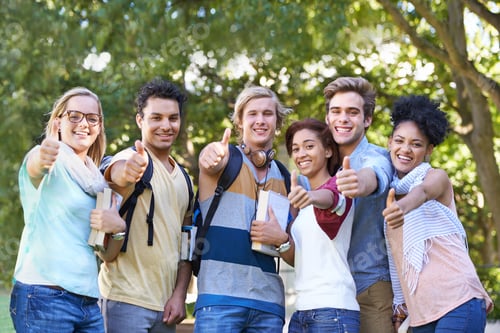 Preview: Portrait of a group of students smiling for the camera with their thumbs up