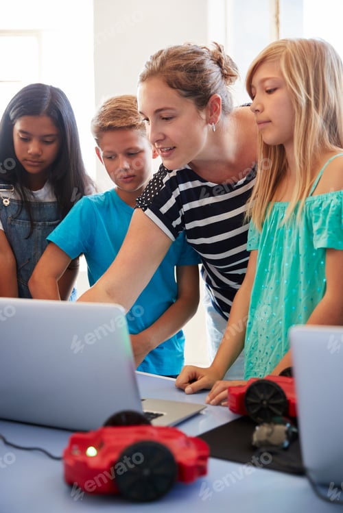 Preview: Group Of Students In After School Computer Coding Class Learning To Program Robot Vehicle