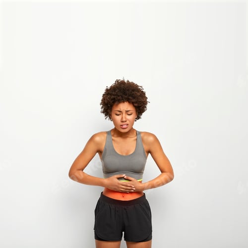 Preview: Vertical image of dissatisfied dark skinned woman with Afro hairstyle, touches belly with both hands