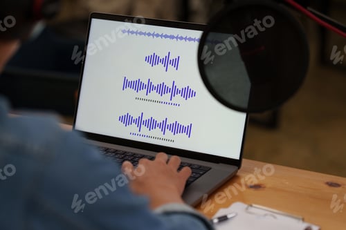 Preview: Podcaster editing audio podcast working at home studio