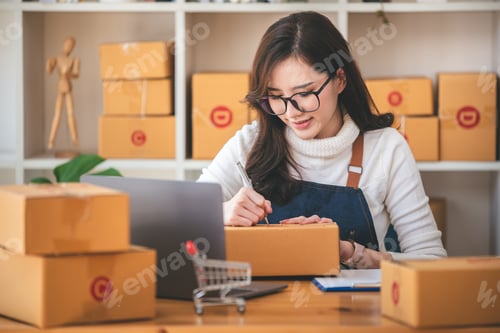 Preview: Small start-up business owners checking parcels at work, freelancers, salespeople, checking producti