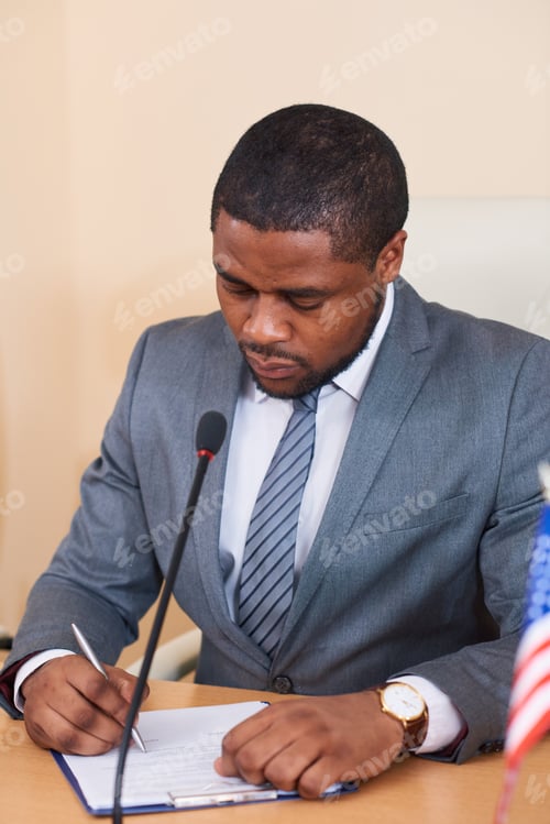 Preview: African-american businessman or delegate in suit