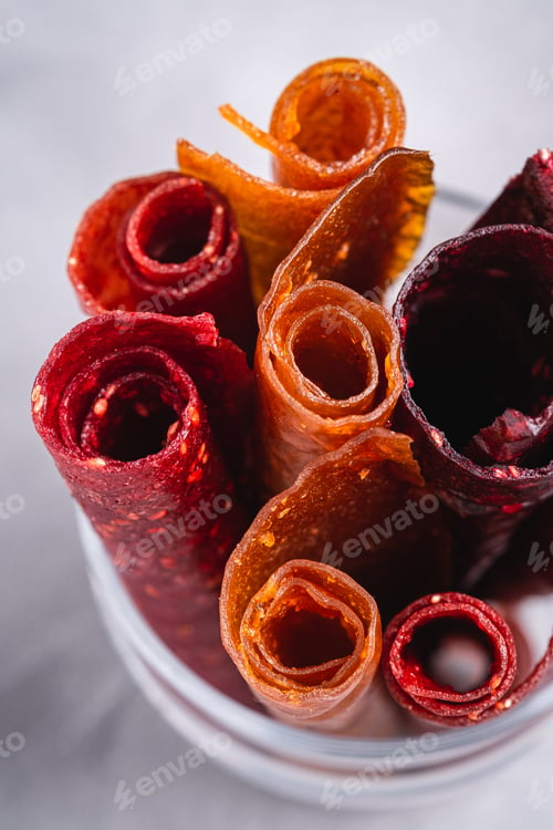 Preview: Fruit pastille in glass cup on stone concrete background