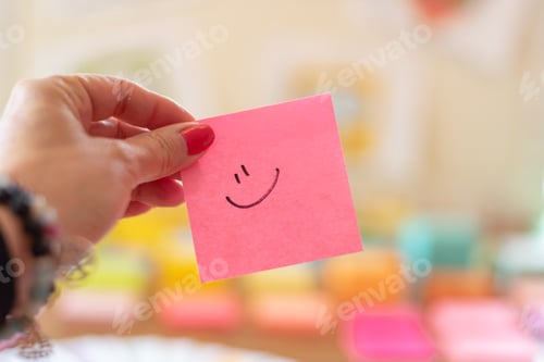 Preview: Bright pink sticky note with a smiley face