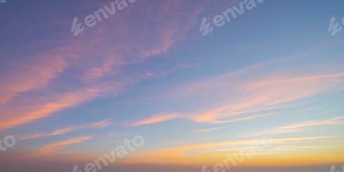 Preview: Sunset sky. Abstract nature background. Dramatic blue and orange, colorful clouds at twilight time.