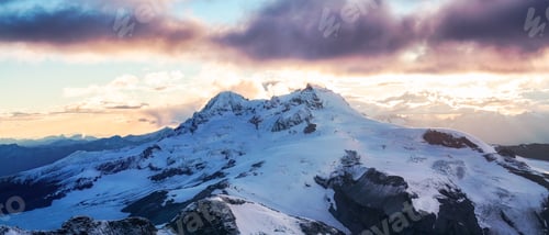 Preview: Glacier and Rocky Mountains covered in snow and clouds. Canadian Aerial Nature Landscape