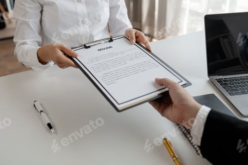 Preview: Woman candidate interview with HR manager in office, Examiner reading a resume during job interview