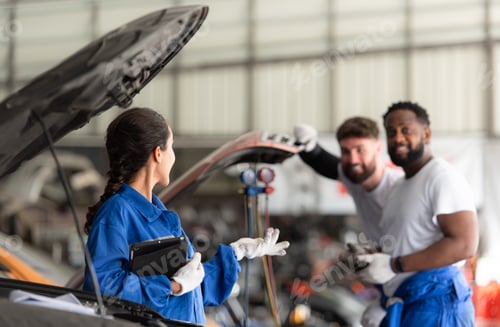 Preview: Car mechanic working in an auto repair shop, inspecting the operation of the car's air conditioner