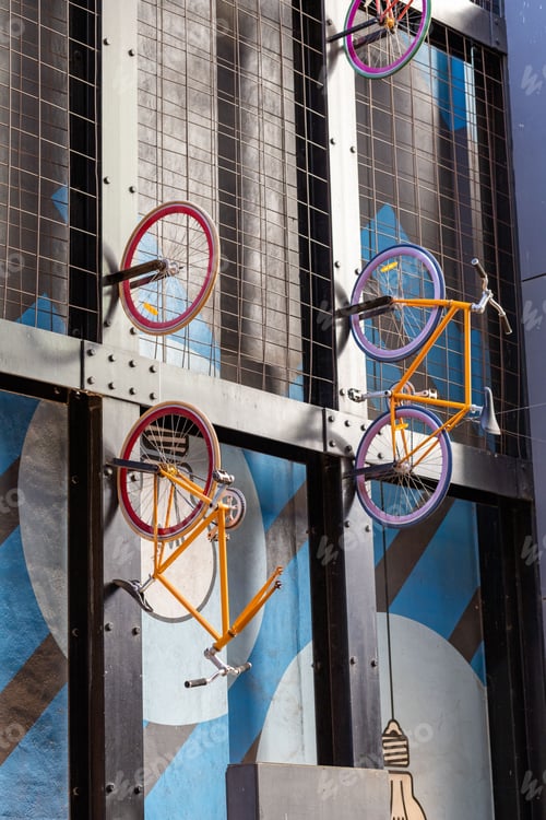 Preview: a close up of a window of a building with bicycles on it