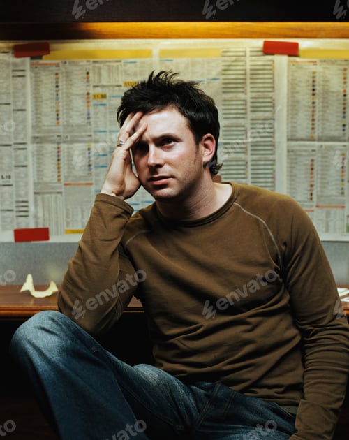 Preview: Stressed man in a betting shop
