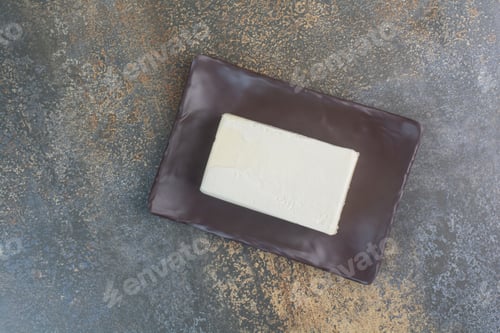 Preview: Organic white cheese on dark plate