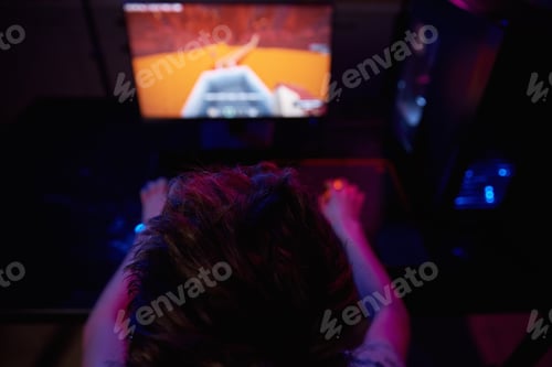 Preview: Gamer play computer game, use rgb neon colored keyboard