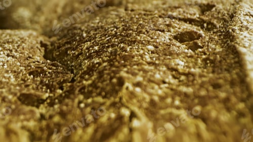 Preview: Freshly baked bread with seeds. Stock footage. Close up view of delicious crispy crust of bread loaf