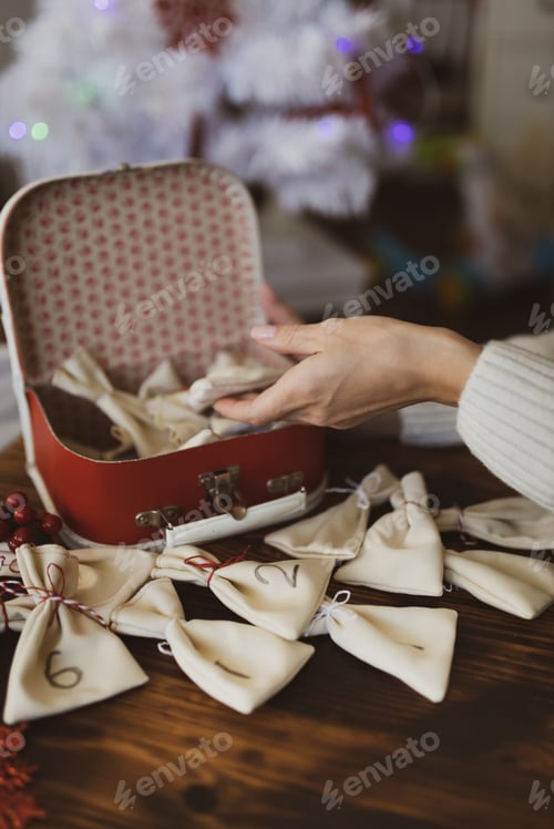 Preview: The girl makes an Advent calendar. The process of creating an Advent calendar. Christmas holidays.