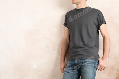 Preview: Men in blank grey t-shirt against color background, space for text