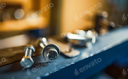 Preview: Metal chrome bolts and nuts on manual flexible massive machine