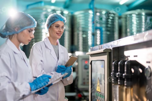 Preview: Caucasian female scientist working in laboratory at factory warehouse.