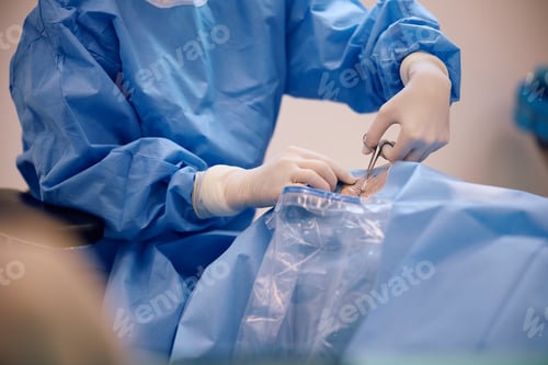 Preview: Close up of nurse preparing a patient for eye surgery at the clinic.