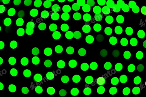 Preview: Unfocused abstract green bokeh on black background. defocused and blurred many round light