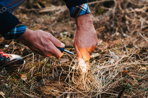 Preview: A man makes a fire with a flint
