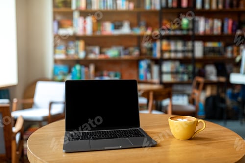 Preview: Workplace in cafe. Laptop computer with black blank screen and mug of coffee on wooden table. Mockup