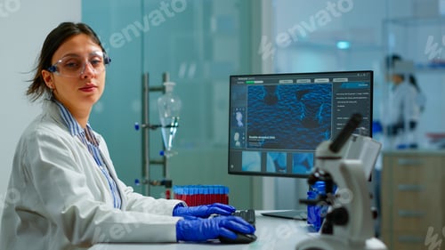 Preview: Portrait of tired scientist trying to smile at camera
