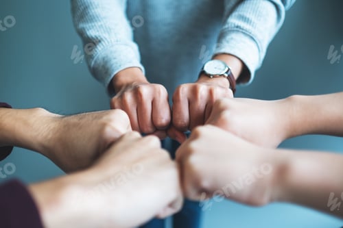 Preview: Group of business team work join their hands together with power and successful concept