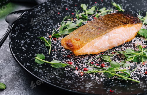 Preview: Salmon steak roasted on black plate