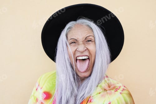 Preview: Funny Senior Woman Making Faces and Sticking Tongue